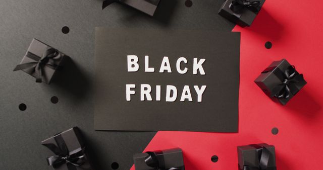 Black friday text in white on black with black gift boxes on red and black background. Luxury treat, present, shopping, black friday sale and retail concept digitally generated image.