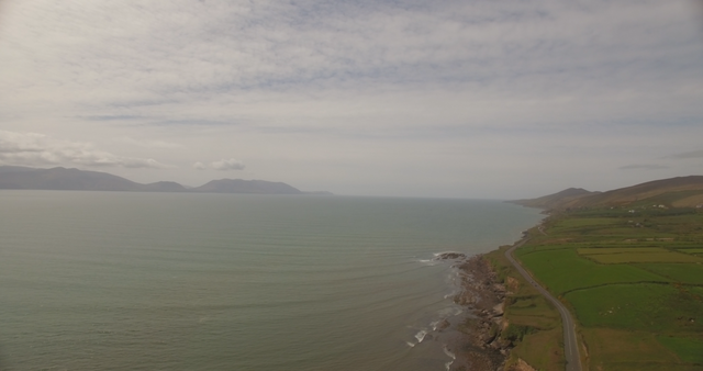 Transparent Sky Above Coastal Landscape With Lush Hills And Sea - Download Free Stock Videos Pikwizard.com