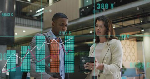 Business Professionals Analyzing Data with Modern Technology