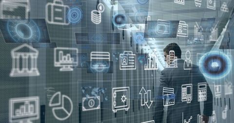 Engineer walking in high-tech server room with digital icons overlay