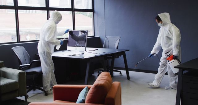 Office Cleaning Crew in Hazmat Suits Disinfecting Workspaces - Download Free Stock Images Pikwizard.com