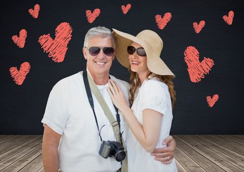 Celebrating love, a happy couple surrounded by hearts conveys romance and joy. Ideal for Valentine's Day promotions or anniversary event invitations.