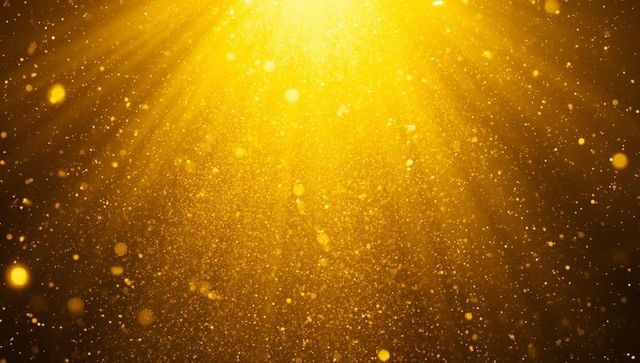 Golden Particles and Rays with Ethereal Glow