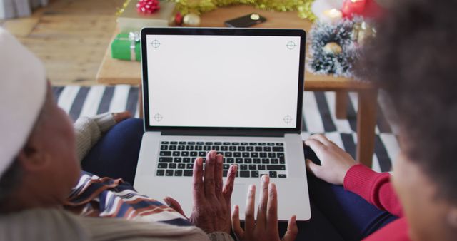 Grandmother and Grandchild Using Laptop Together During Holidays - Download Free Stock Images Pikwizard.com