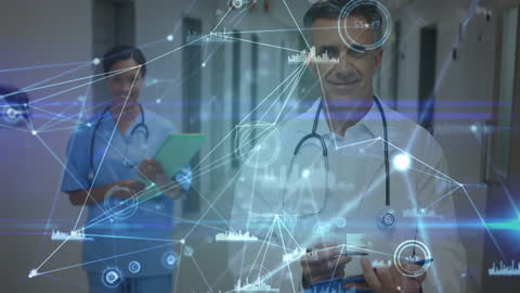 Doctors Utilizing Digital Data Interfaces in Hospital Hallway