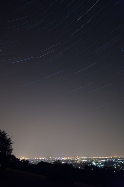 Star Trails Over Cityscape at Night - Download Free Stock Images Pikwizard.com