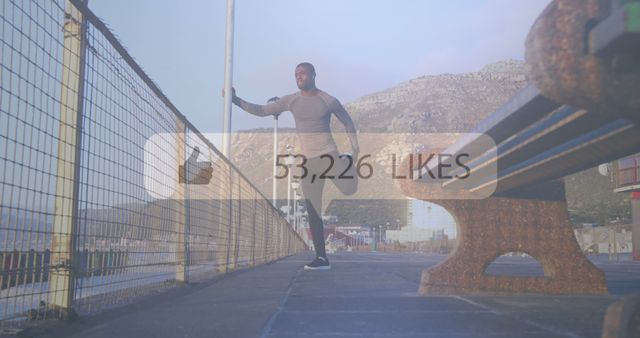 Fit Man Stretching Outdoors on Promenade with Digital Likes Overlay - Download Free Stock Images Pikwizard.com