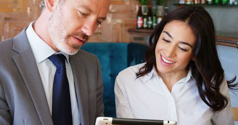 Professional Mentorship with Businessman and Young Woman Using Tablet - Download Free Stock Images Pikwizard.com