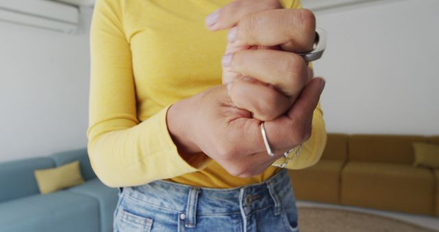 Person Cracking Knuckles in Living Room Close-Up - Download Free Stock Images Pikwizard.com