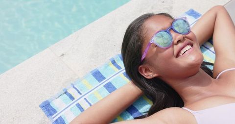 Teenage Girl Relaxing by Poolside on Summer Day - Download Free Stock Images Pikwizard.com