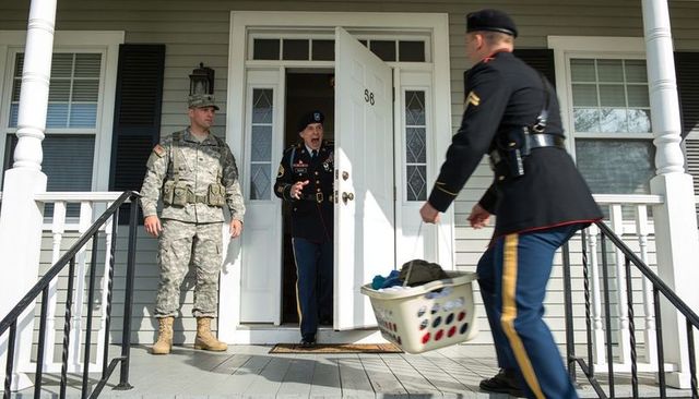 Surprise military homecoming on suburban porch, dress uniform reunion with raw reaction