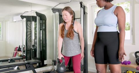 Diverse Fitness Training with Kettlebells in Modern Gym