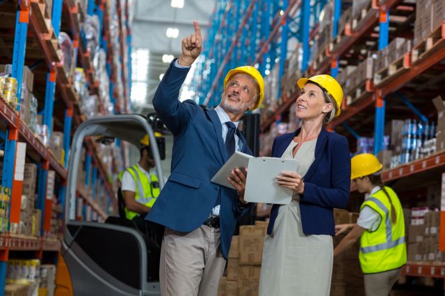 Warehouse manager and client interacting with each other in warehouse