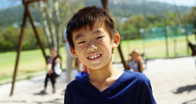 Smiling Boy Enjoying Sunny Day at Playground - Download Free Stock Images Pikwizard.com