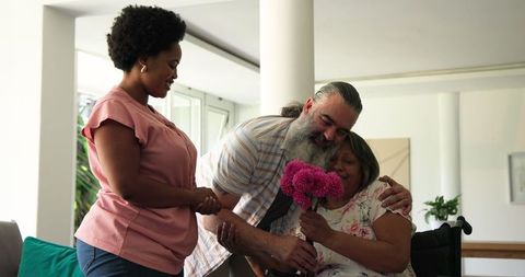 Family Cherishing Time with Senior Woman in Home Setting