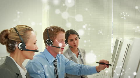 Diverse Business Team Analyzing Data with Headsets