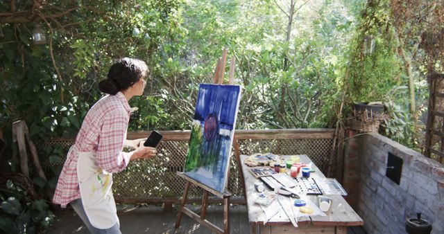 Woman Paints Colorful Landscape on Canvas Outdoors - Download Free Stock Images Pikwizard.com