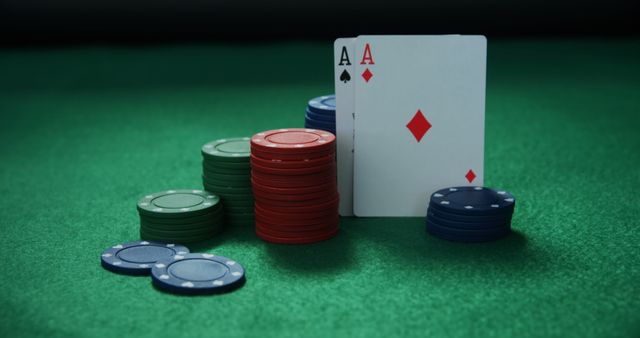 Playing cards and casino chips on poker table in casino 