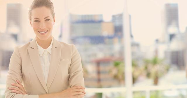 Confident businesswoman in professional attire standing in modern office with city view in background. Ideal for use in corporate branding, business websites, leadership content, career counseling materials, or articles on business success.