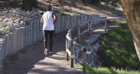 Senior Man Running on Nature Trail for Fitness