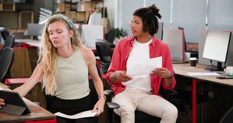 Modern Office Professionals Collaborating on Project