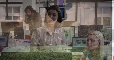 Diverse Businesswomen in Office with Social Media Symbol Overlay