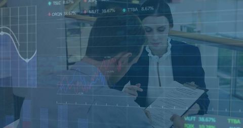 Business executives analyzing financial data with stock market overlay