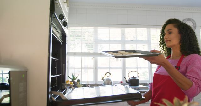 Woman Baking Cookies in Modern Kitchen on Sunny Day - Download Free Stock Images Pikwizard.com