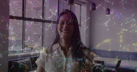 Smiling Businesswoman Amidst Digital Data Overlay in Modern Office