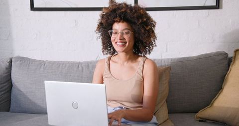 Smiling Professional Woman Working on Laptop