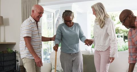 Senior Friends Cherishing Leisure Time in Cozy Home Gathering