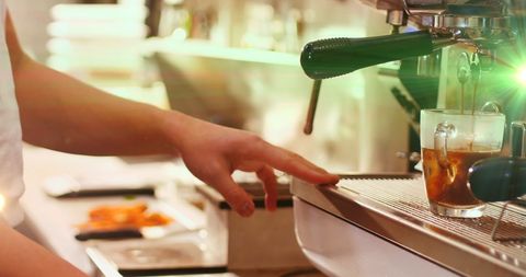 Barista crafting espresso in cafe setting