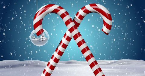 Candy canes and christmas ornament in snowy wonderland