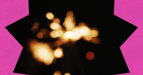Festive purple star with glowing sparklers background