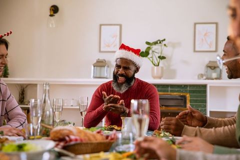 Joyful Christmas Celebration with Friends at Festive Dinner