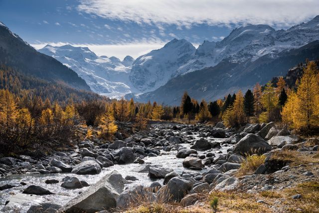 Scenic Mountain Stream with Autumn Trees and Snow-Capped Peaks - Download Free Stock Photos Pikwizard.com
