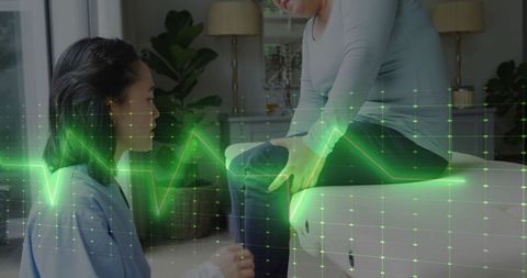 Physiotherapist with patient analyzing digital medical data