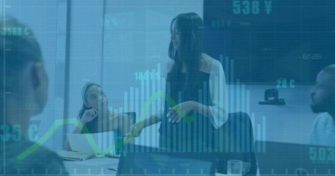 Executive presenting data visualization, charts and graphs to team in modern boardroom