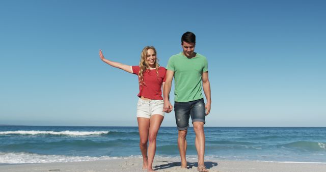 Happy Couple Holding Hands and Walking on Beach Shore - Download Free Stock Images Pikwizard.com