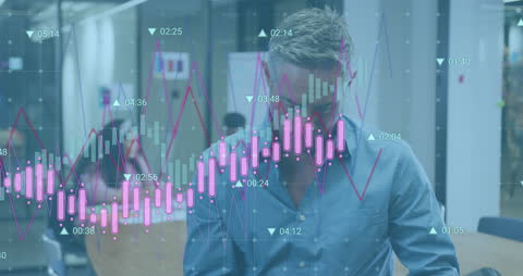 Businessman Analyzing Data with Graph Overlay in Modern Office
