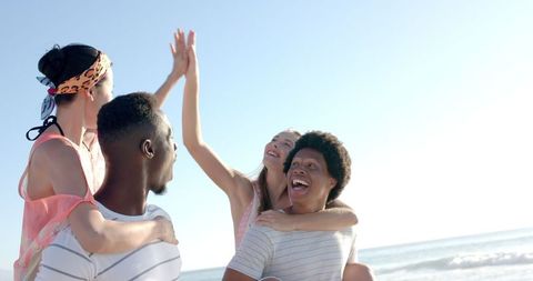 Diverse Friends Celebrating Beach Day with Joy and Laughter