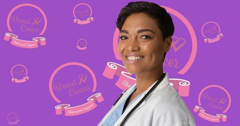 Smiling African American Female Doctor Supporting Breast Cancer Awareness