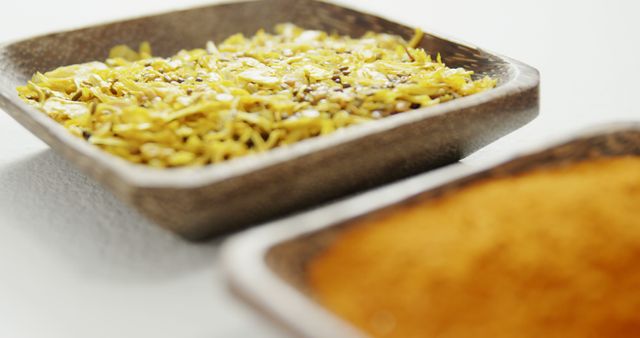 Close-up of yellow spices in square ceramic bowls - Download Free Stock Images Pikwizard.com