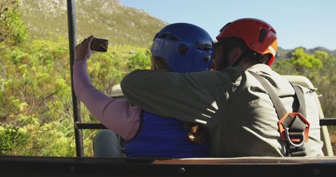 Couple Wearing Helmets Taking Selfie in Mountainous Landscape - Download Free Stock Images Pikwizard.com