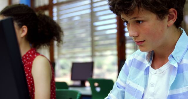 Teenage Students Focused on Computer Work in Classroom Setting - Download Free Stock Photos Pikwizard.com