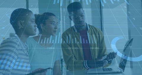 Colleagues Reviewing Digital Analytics in Modern Office Environment