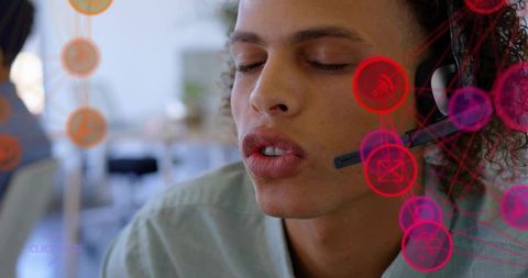 Young man speaking on headset in open-plan office with voice ui overlays for customer support