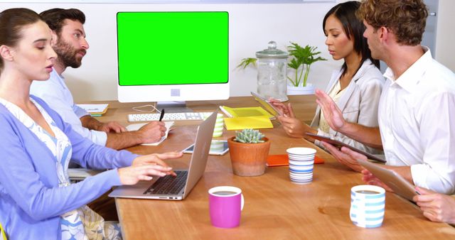 Diverse Business Team in Meeting With Green Screen Monitor - Download Free Stock Images Pikwizard.com