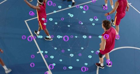 Basketball players practicing with ai network overlay on blue court for smart analytics