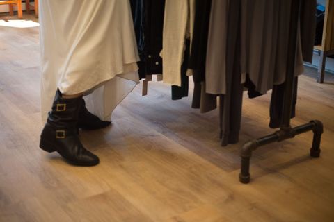 Woman Shopping for Clothes in Retail Store